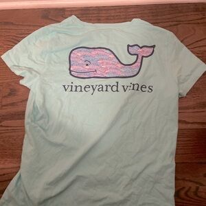 Teal vineyard vines shirt.